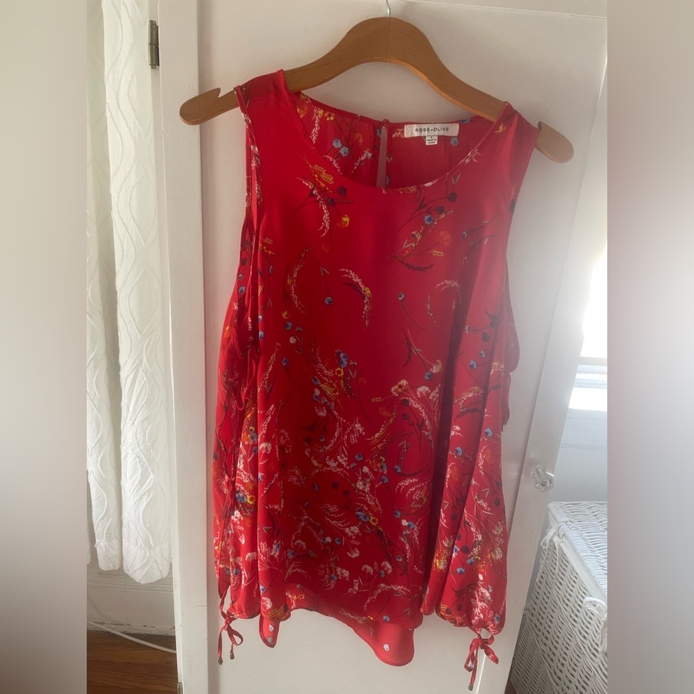 Red Floral Open Shoulder Top with cut out sleeves.